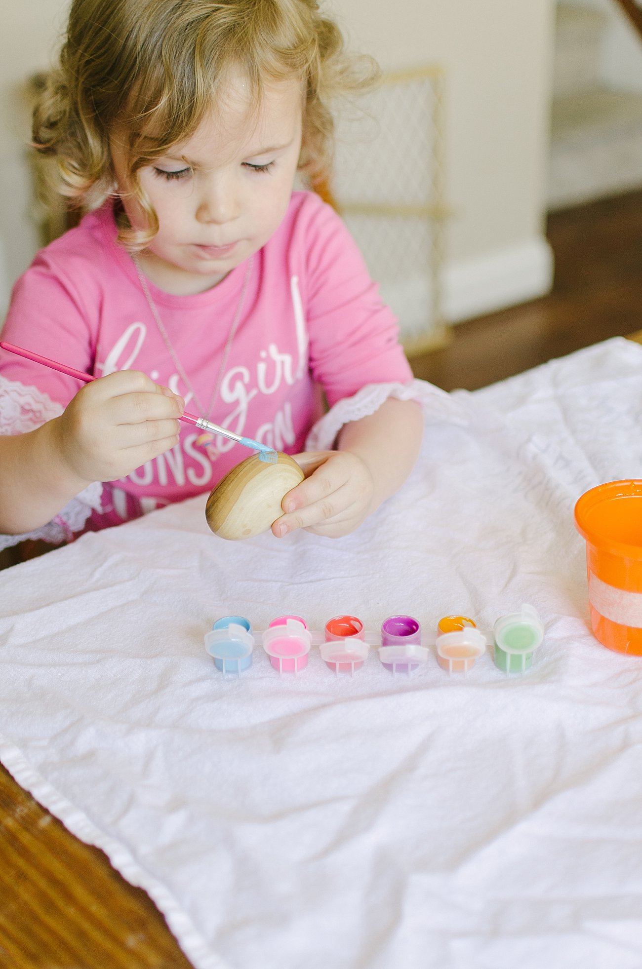 Easter Traditions with Kids - Painting Handmade Wooden Easter Eggs by lifestyle blogger Still Being Molly 